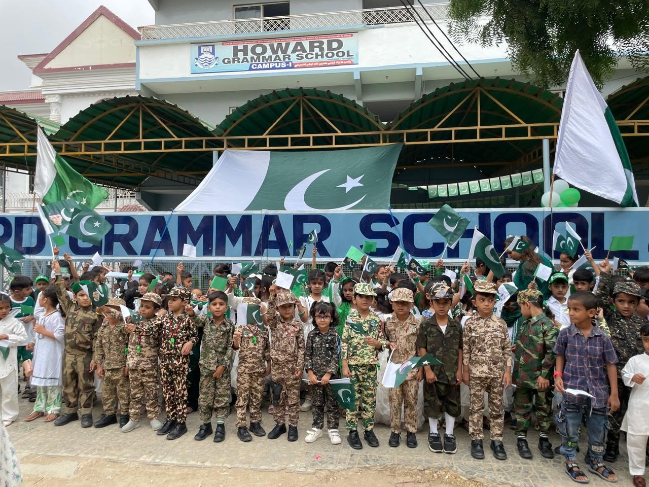 Modern HGS classroom with Pakistani students in white and grey uniform